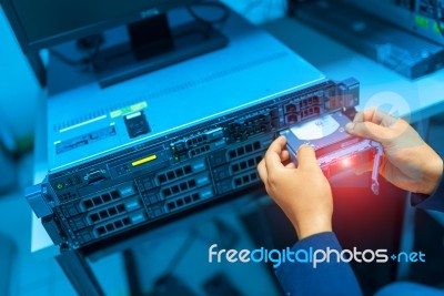 Man Fix Server Network In Data Center Room Stock Photo