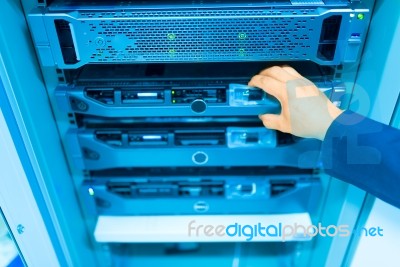 Man Fix Server Network In Data Center Room Stock Photo