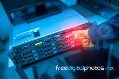 Man Fix Server Network In Data Center Room Stock Photo