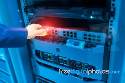 Man Fix Server Network In Data Center Room Stock Photo