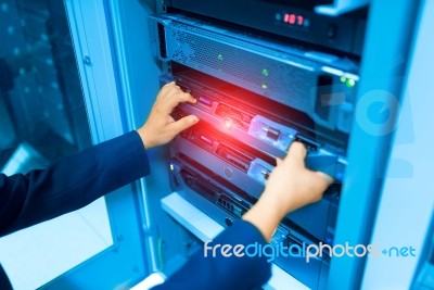 Man Fix Server Network In Data Center Room Stock Photo