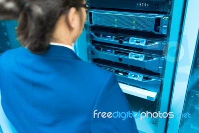 Man Fix Server Network In Data Center Room Stock Photo