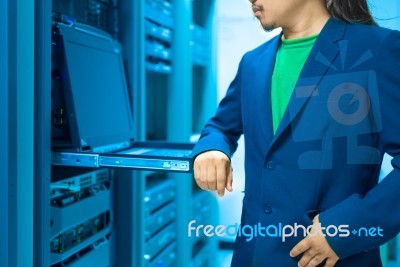 Man Fix Server Network In Data Center Room Stock Photo