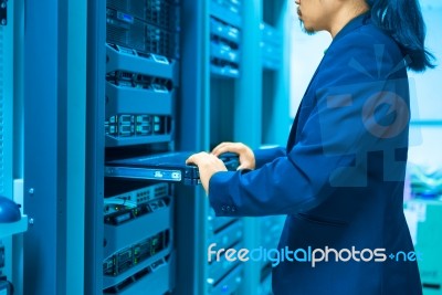 Man Fix Server Network In Data Center Room Stock Photo