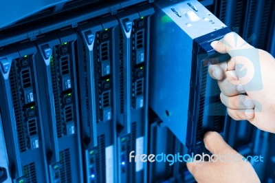 Man Fix Server Network In Data Center Room Stock Photo