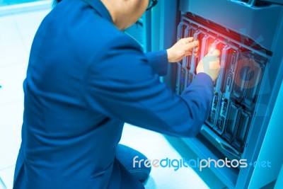 Man Fix Server Network In Data Center Room Stock Photo