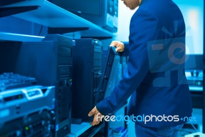 Man Fix Server Network In Data Center Room Stock Photo