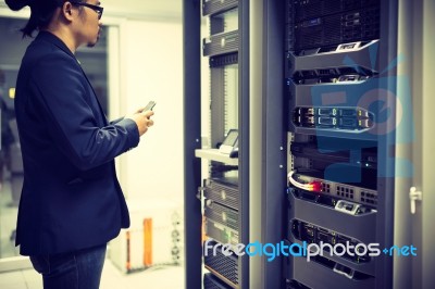 Man Fix Server Network In Data Center Room Stock Photo