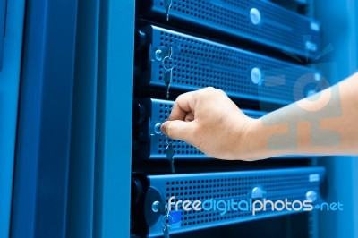 Man Fix Server Network In Data Center Room Stock Photo