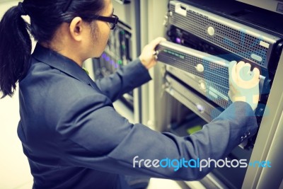 Man Fix Server Network In Data Center Room Stock Photo