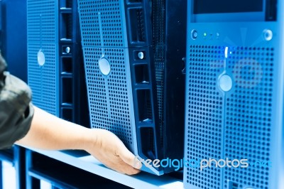 Man Fix Server Network In Data Center Room Stock Photo