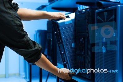 Man Fix Server Network In Data Center Room Stock Photo