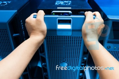 Man Fix Server Network In Data Center Room Stock Photo