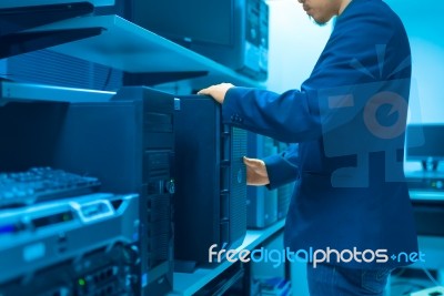 Man Fix Server Network In Data Center Room Stock Photo