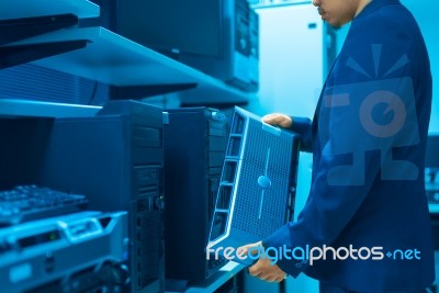 Man Fix Server Network In Data Center Room Stock Photo