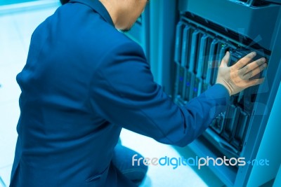 Man Fix Server Network In Data Center Room Stock Photo