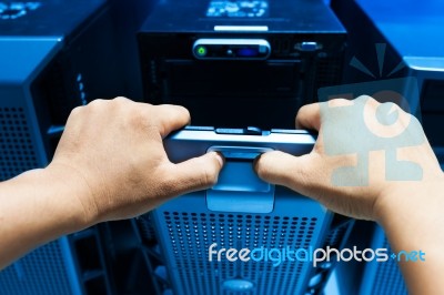 Man Fix Server Network In Data Center Room Stock Photo