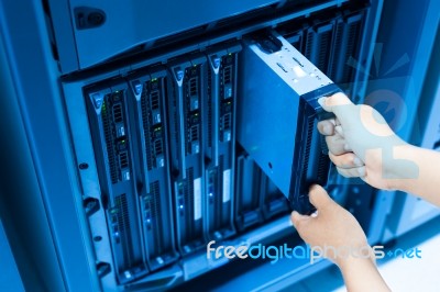 Man Fix Server Network In Data Center Room Stock Photo