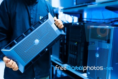 Man Fix Server Network In Data Center Room Stock Photo