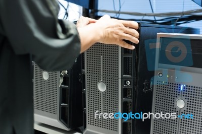 Man Fix Server Network In Data Center Room Stock Photo