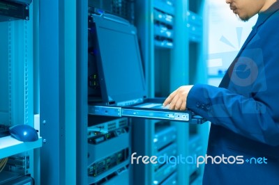 Man Fix Server Network In Data Center Room Stock Photo