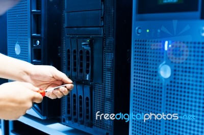 Man Fix Server Network In Data Center Room Stock Photo