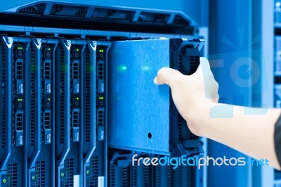 Man Fix Server Network In Data Center Room Stock Photo