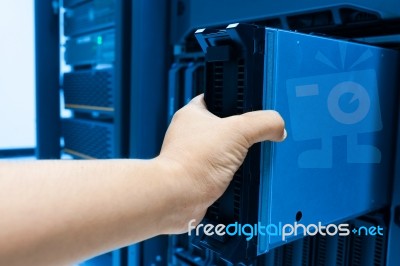 Man Fix Server Network In Data Center Room Stock Photo