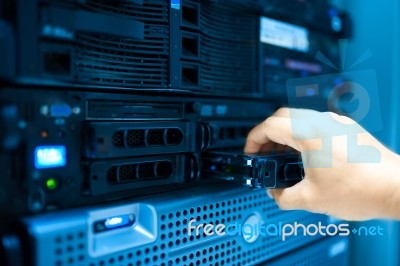 Man Fix Server Network In Data Center Room Stock Photo