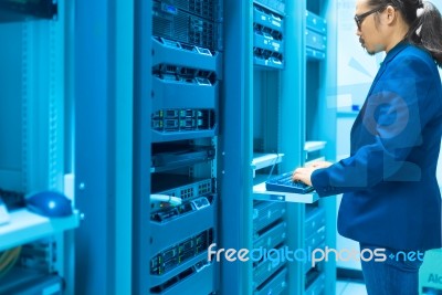 Man Fix Server Network In Data Center Room Stock Photo