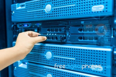 Man Fix Server Network In Data Center Room Stock Photo