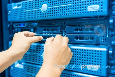 Man Fix Server Network In Data Center Room Stock Photo