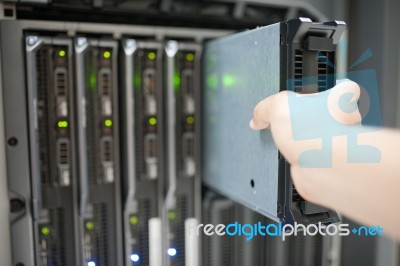 Man Fix Server Network In Data Center Room Stock Photo