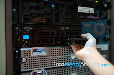 Man Fix Server Network In Data Center Room Stock Photo