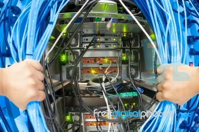 Man Fix Server Network In Data Center Room Stock Photo