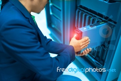 Man Fix Server Network In Data Center Room Stock Photo