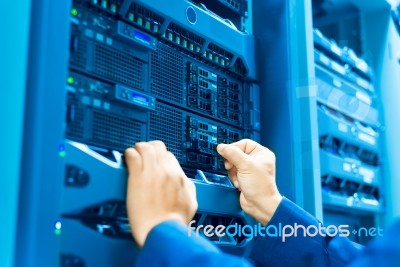 Man Fix Server Network In Data Center Room Stock Photo