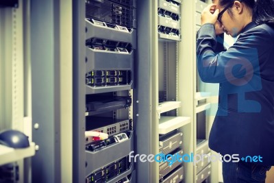 Man Fix Server Network In Data Center Room Stock Photo