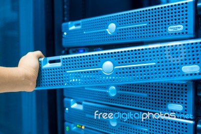 Man Fix Server Network In Data Center Room Stock Photo