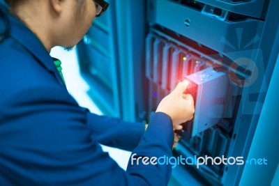 Man Fix Server Network In Data Center Room Stock Photo