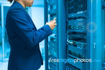 Man Fix Server Network In Data Center Room Stock Photo