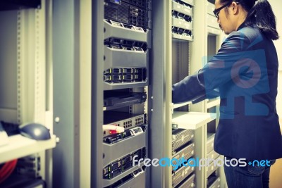 Man Fix Server Network In Data Center Room Stock Photo