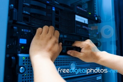 Man Fix Server Network In Data Center Room Stock Photo