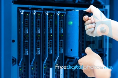 Man Fix Server Network In Data Center Room Stock Photo