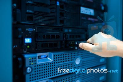 Man Fix Server Network In Data Center Room Stock Photo