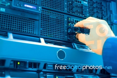 Man Fix Server Network In Data Center Room Stock Photo