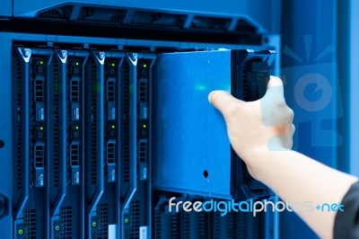 Man Fix Server Network In Data Center Room Stock Photo