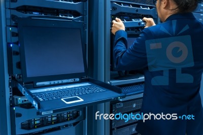 Man Fix Server Network In Data Center Room Stock Photo