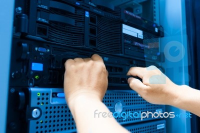 Man Fix Server Network In Data Center Room Stock Photo