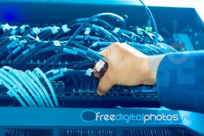 Man Fix Server Network In Data Center Room Stock Photo